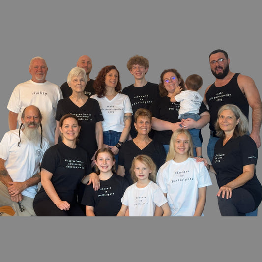 Family wearing Civic Roots apparel during a behind-the-scenes photo shoot supporting civic participation.